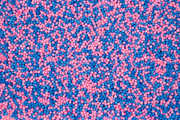 A vibrant and playful texture of pink and blue foam balls creating a colorful and abstract pattern. Perfect for backgrounds, design concepts, and artistic projects.