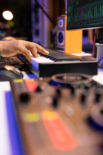 istock Artist composer playing a track on midi controller in home studio 2168079528