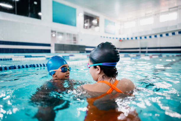 istock Children talking at swimming pool 2168081126