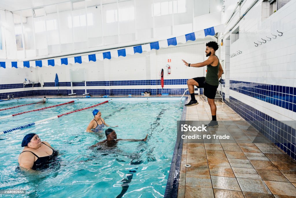Educate Pool Users Instructor Training Students At Swimming Pool Stock Photo - Download ...