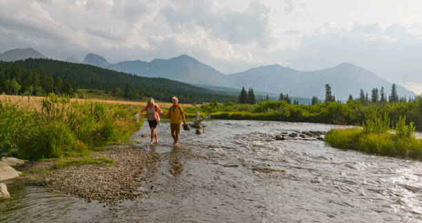 istock Mature couple explore river together 2168083082