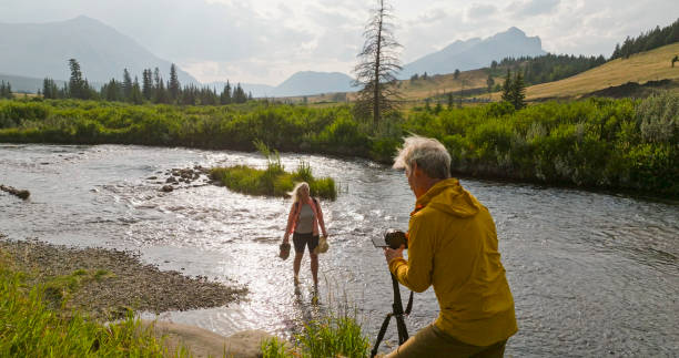 istock Mature couple explore river together 2168083381