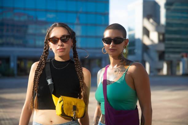 istock Two young woman standing looking at camera 2168083426
