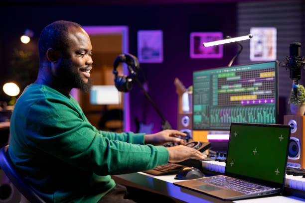 istock Young artist producing new tracks on daw software next to an isolated mockup 2168085493