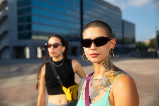 istock Two young woman standing looking at camera 2168087142