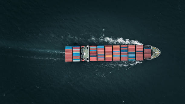 istock logistic cargo container ship sailing in sea to import export goods and distributing products to dealer and consumers across worldwide, by container ship Transport business service. 2168088246