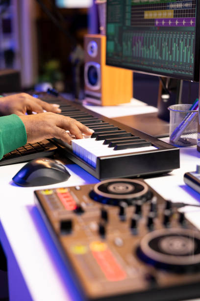 istock Sound designer recording his electronic piano notes in home studio 2168088557