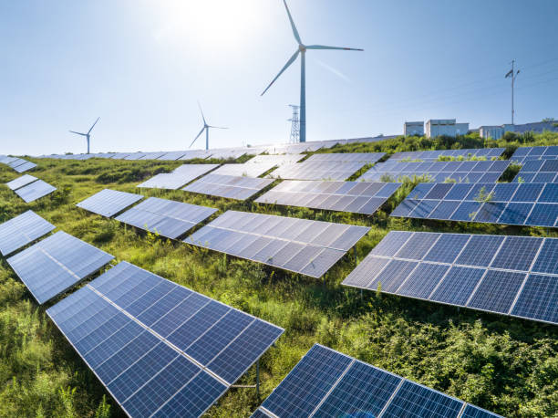 istock Wind turbines and solar panels on mountain 2168090101