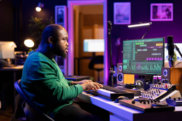 istock Creative songwriter recording new tracks with microphone and midi controller 2168093613