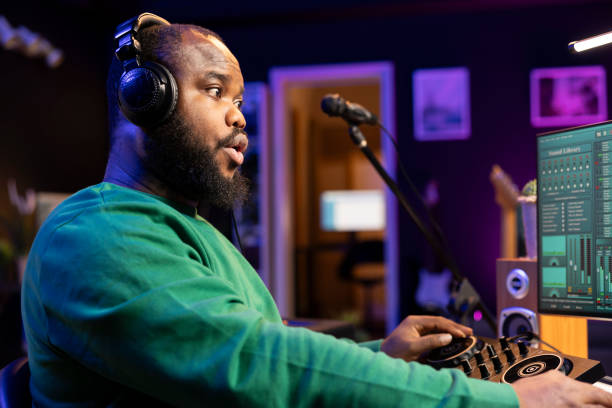 istock Talented musician mixing and mastering songs on a console 2168093845