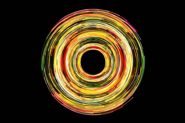 istock Abstract sun, neon circle lines with empty copy space inside isolated on black background. Yellow led lights long exposure rotation photo. 2168094205