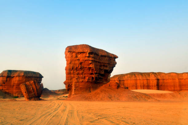 Tômbua (Porto Alexandre), Namibe Province, Angola: buttes at Colinas Canyon, a red sandstone canyon on the Curoca river estuary - rock formations sculpted by water and wind erosion - 'Colinas do Curoca', an iconic place with a beauty that impresses with its grandeur, reminiscent of the “Grand Canyon”.