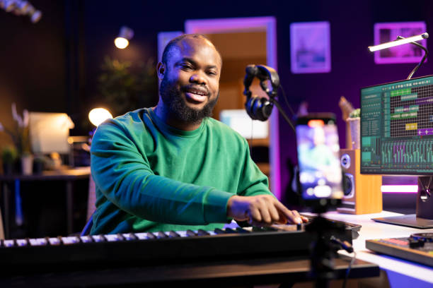 istock Musician doing online paid classes to help people play piano notes 2168094395