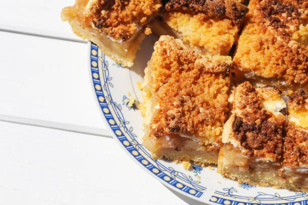 istock Homemade apple pie on a white wooden table. Pie served on a plate. 2168095168