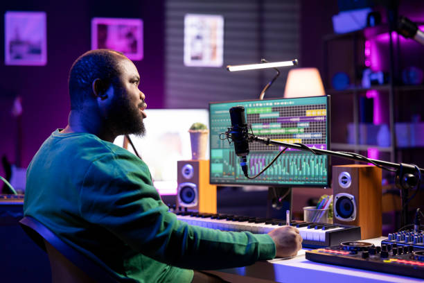 istock Talented famous composer writes down new verses and lyrics in home studio 2168096592