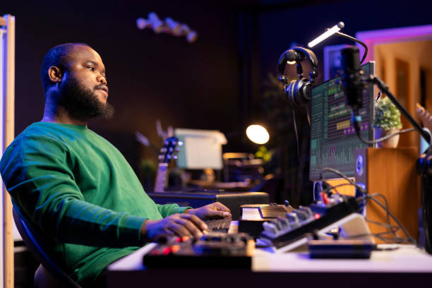 istock Sound engineer playing piano and mixing tunes on digital software 2168096774