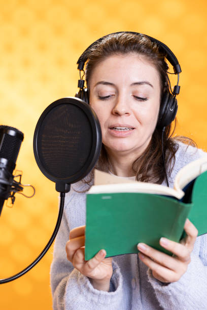 istock Woman producing audiobook, isolated over studio background 2168098606