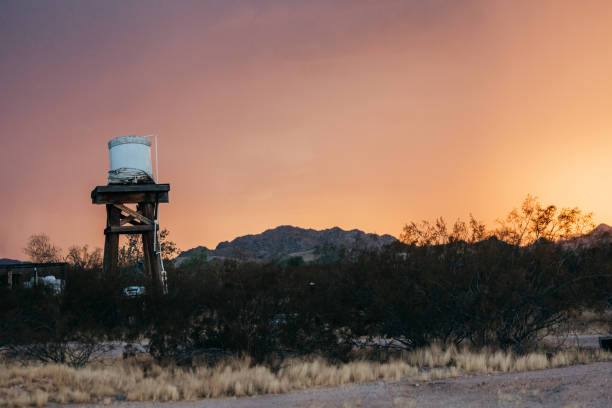 Water cistern on elevated platform at sunset, Sonoran desert