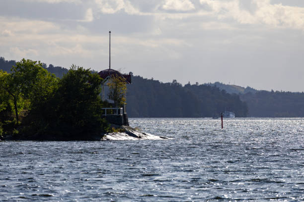 istock Lakeside Serenity with House and Boat 2168103904