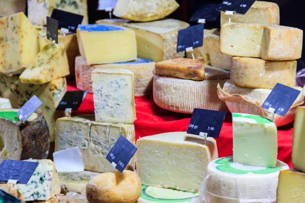 istock Different types of cheese at market stall 2168104461