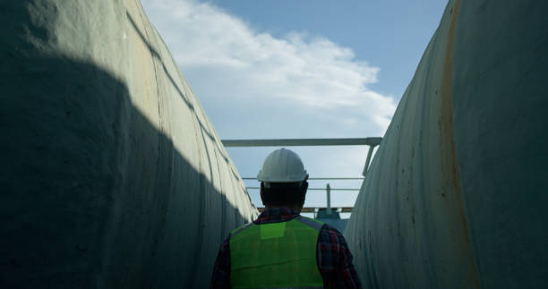 istock A contractor is working to inspect before handing over work to a company for maintenance on a large industrial plant's water system. 2168106406