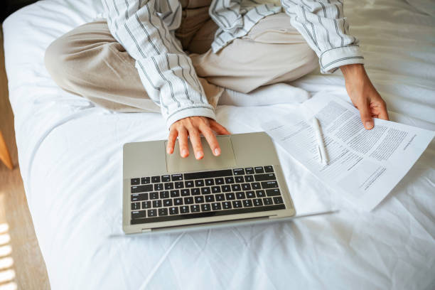 istock Cheerful Asian Woman Balancing Work from Home 2168107031