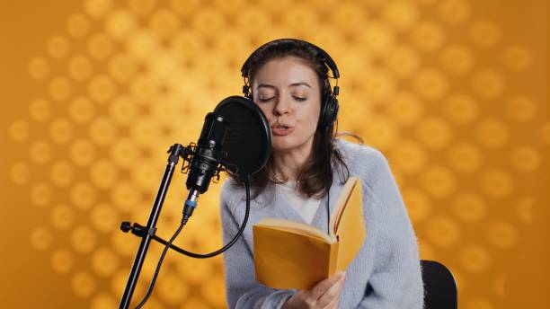 istock Voice actor recording audiobook using microphone and headset 2168108597