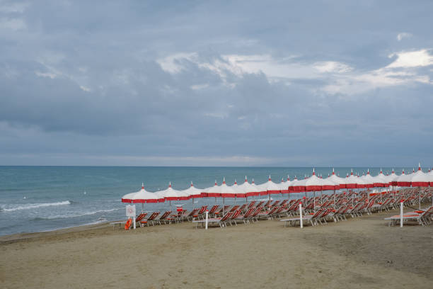 istock Beach umbrellas for rent on beach, Tuscany 2168109670