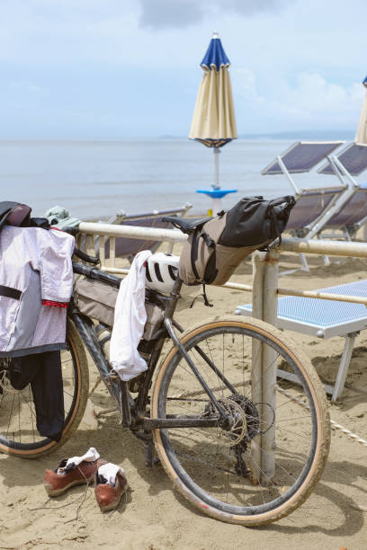 istock Bikepacker bicycle on beach, Tuscany 2168109709