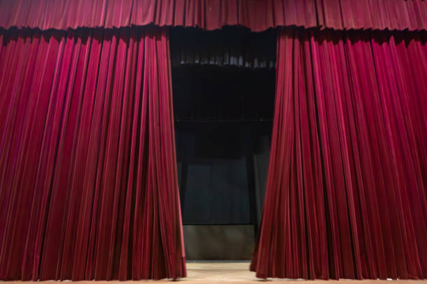 istock Red curtain on a theater stage 2168110632