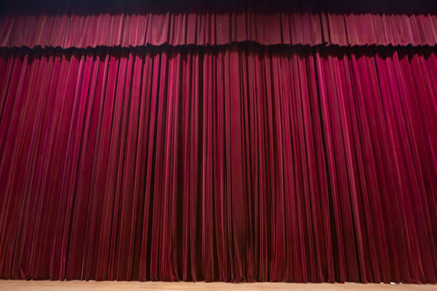 istock Red curtain on a theater stage 2168110633