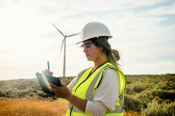 istock Woman Technician Working With Wind Turbines 2168111161