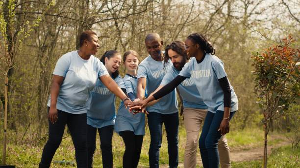 istock Joyful optimistic group of activists unites to clear out the woods 2168111352