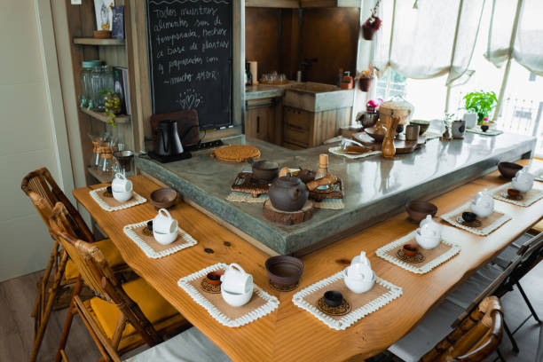Tea ceremony accessories waiting on a rustic table in a cozy tea shop