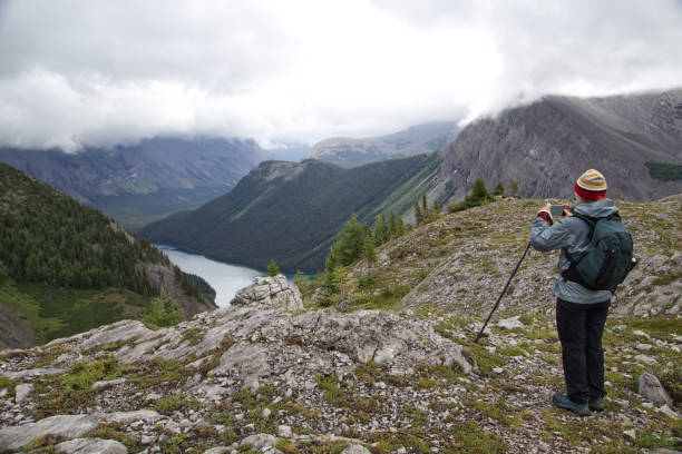 istock IMG_0776 Hiker taking a photo, Assiniboine 2168114780
