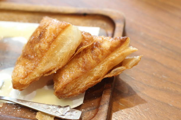 istock Crispy bread with sweetened condensed milk on table in coffee shop. 2168119984
