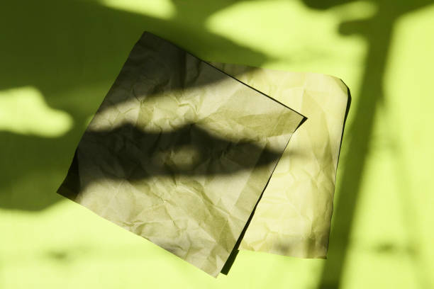 istock color paper background with lights and shadows 2168128298