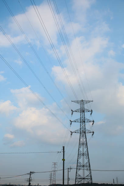 istock blue sky, summer clouds and electric line 2168128523