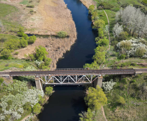 istock Aerial view of the railway bridge over a small river 2168141053