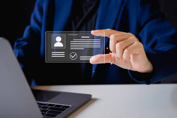 istock Digital identification or digital ID concept. Businessman use laptop and hand touch virtual screen of digital identification card to accessing databases by digital identity for cyber security. 2168141683