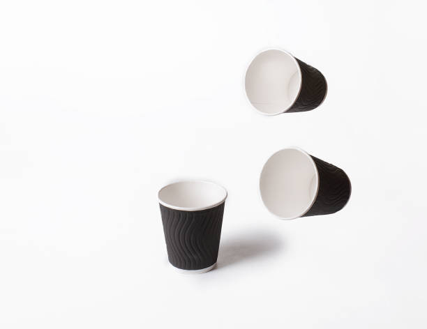 istock Three black paper cups on a white background. 2168141846