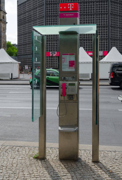 Berlin, Germany - September 5, 2018: Telephone booth on street in Berlin, Germany