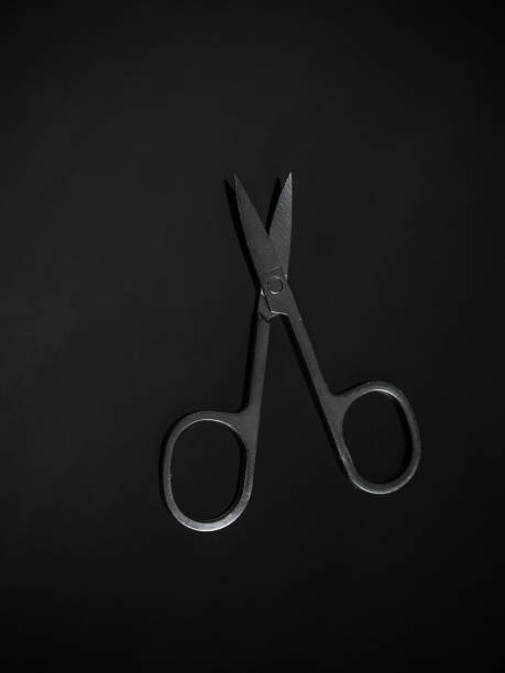 istock Minimalist Black Stainless Steel Scissors on Dark Background - Modern Design Tool 2168142941
