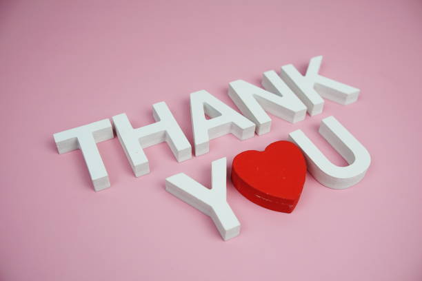 istock Thank You alphabet letters top view on pink background 2168145199