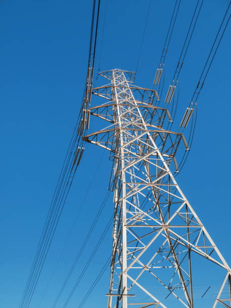istock Electricity transmission pylon against blue sky 2168145410