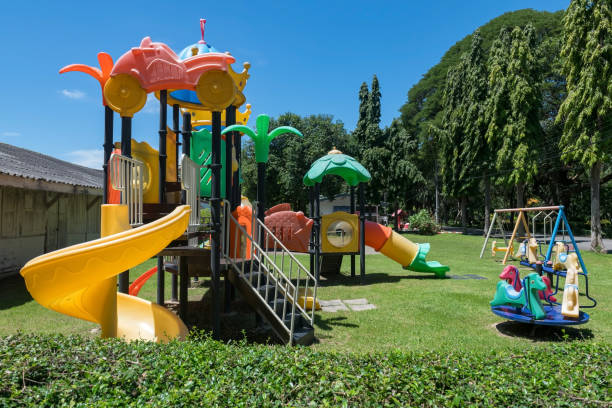 istock Kid Playgrounds on green grass field in garden and blue sky 2168145794