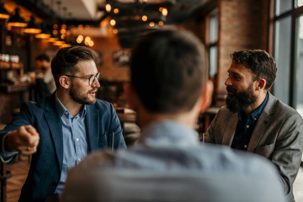 istock Relaxed businessmen chatting in the restaurant 2168146612