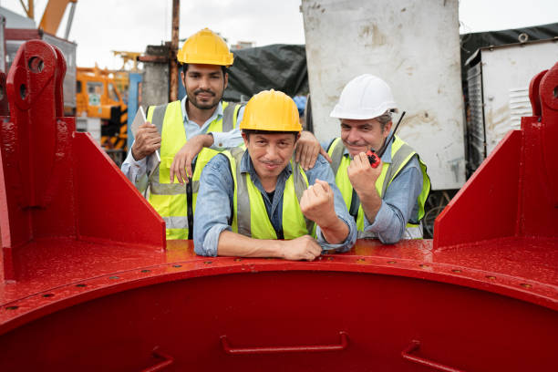 istock Cheer Team engineers man worker checking machine and use tablet computer with spare crane background 2168150365