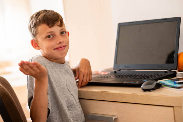 istock the boy is doing homework on laptop but he does not know it 2168150833