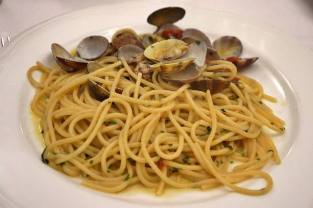 istock Italian cuisine: spaghetti with clams in Amalfi, Italy 2168152543